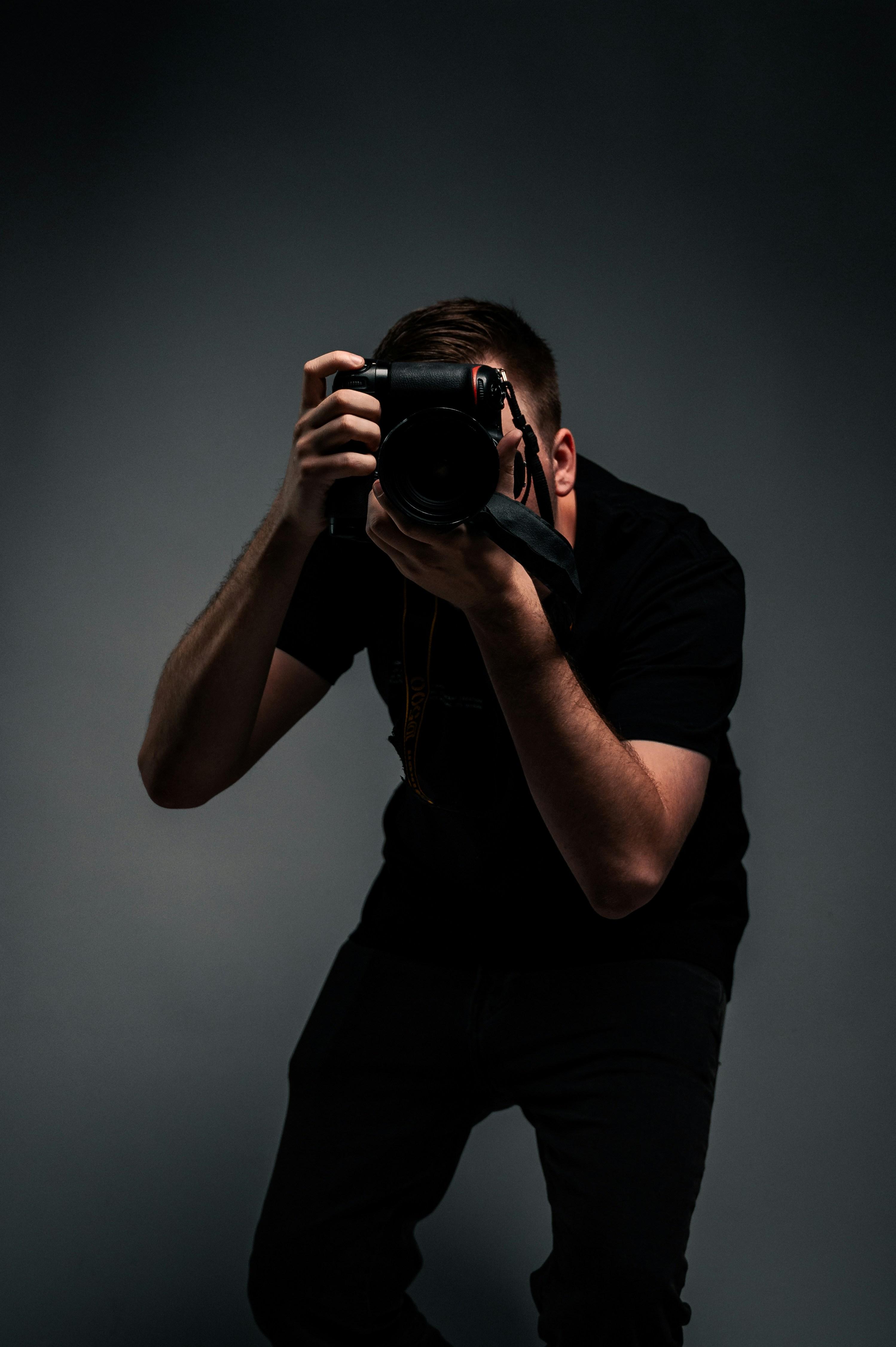 Photographer capturing an intimate wedding moment
